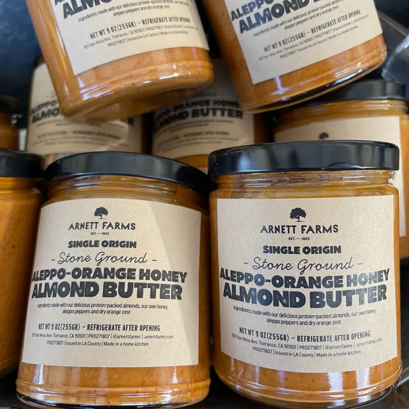 a jar of our homemade aleppo-orange honey almond butter